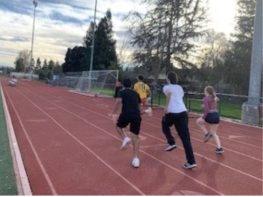 The Track Jumps team warms up for their hard workout a few weeks before season starts.